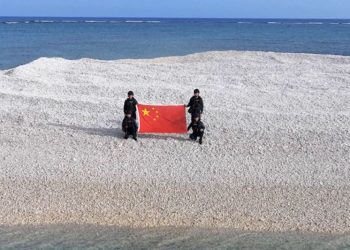 China and Philippines unfurl competing flags on disputed South China Sea sandbars, reviving tensions