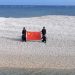 China and Philippines unfurl competing flags on disputed South China Sea sandbars, reviving tensions