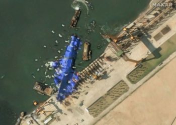 North Korea deploys mystery balloon-like objects to stricken warship, satellite photos show