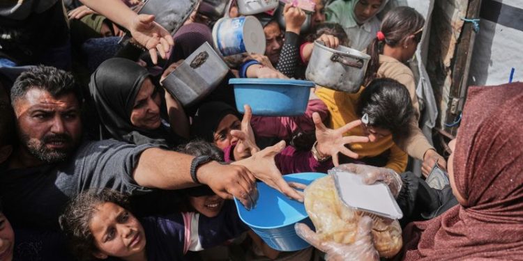 A US-backed group says it will deliver aid to Gaza, but humanitarian organizations are skeptical. Here’s what we know